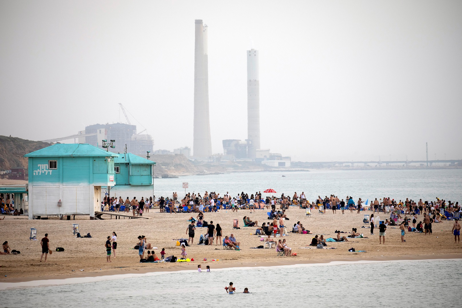 The summer will be much hotter. A beach in front of the power station in Hadera |