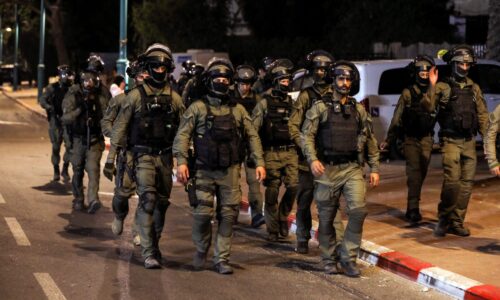 Israeli security force members patrol during a night-time curfew following violence in the Arab-Jewish town of Lod REUTERS/Ammar Awad
