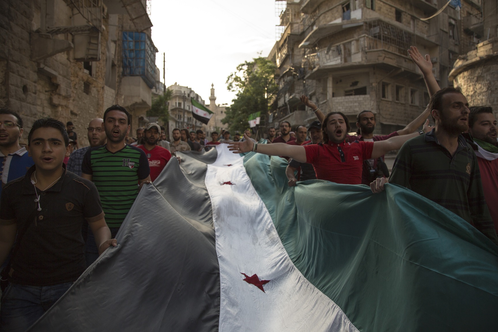 Syrians demonstrating dur- ing an anti-regime protest in eastern Aleppo, May 5, 2016. Photo: Karam al-Masri / AFP