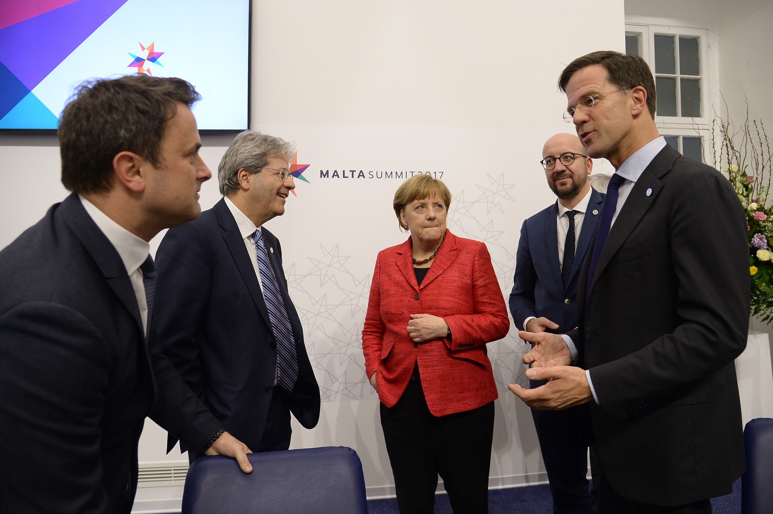 Germany's Chancellor Angela Merkel (C) chats with Luxembourg's Prime Minister Xavier Bettel (L), Italy's prime Minister Paolo Gentiloni (2ndL), Netherland's Prime Minister Mark Rutte (R) and Belgium's Prime Minister Charles Michel (2ndR) during an European Union summit on February 3, 2017 in Valletta, Malta. European Union leaders will try to rally together to revive the beleaguered bloc at a special summit in Malta Friday in the face of