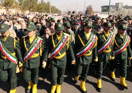 Members of the Iranian Revolutionary Guard carry the casket of Iran's Revolutionary Guards Brigadier General Mohsen Ghajarian, who was killed in the northern province of Aleppo by jihadists in Syria, during their funeral procession in the capital Tehran, on February 6, 2016. Brigadier General Mohsen Ghajarian of the elite Revolutionary Guards was killed in the northern province of Aleppo, according to the Fars news agency, which is close to the Guards. He was advising pro-government forces in the fight against the Islamic State (IS) jihadist group, it reported, without saying when he died. ATTA KENARE / AFP