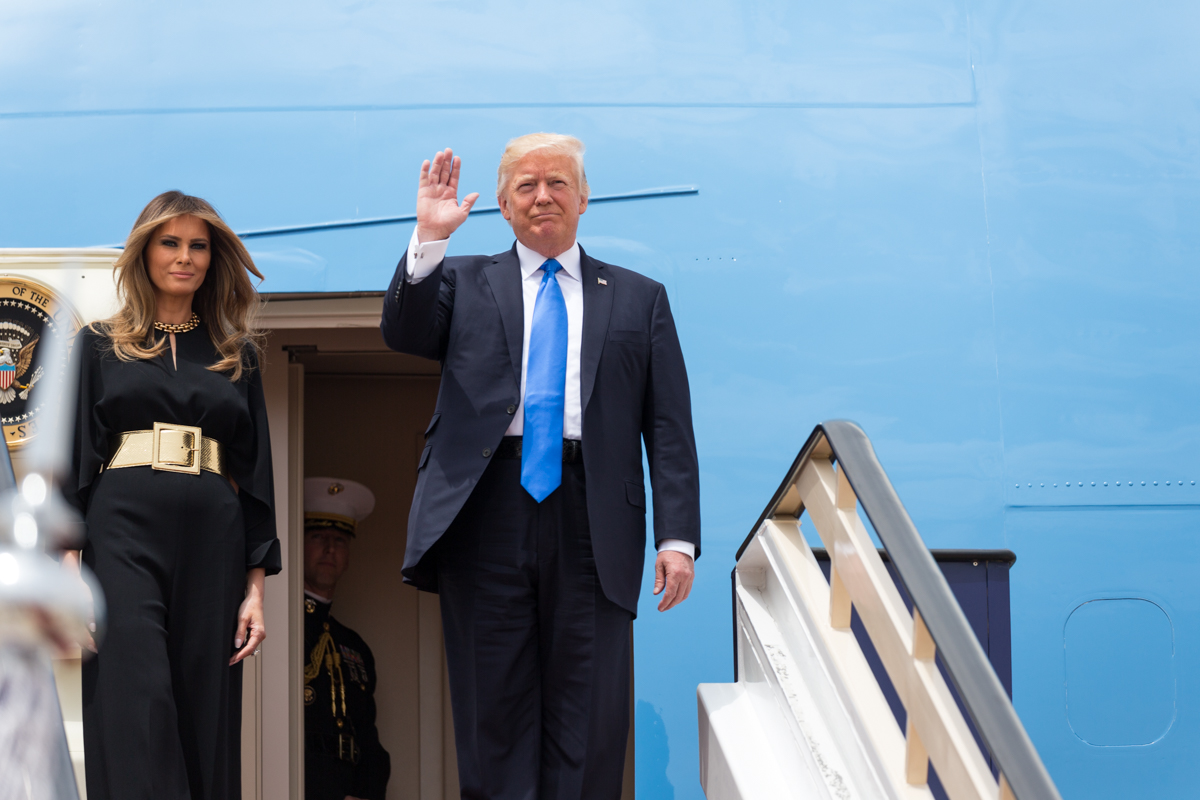 President Donald Trump waves as he and First Lady Melania Trump arrive, Saturday, May 20, 2017, to King Khalid International Airport in Riyadh, Saudi Arabia