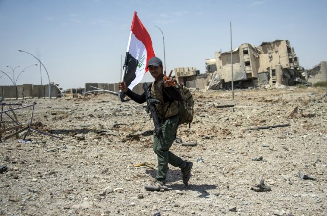 Members of Iraq's elite Rapid Response Division, patrol in the Shifa neighbourhood, on the west bank of Mosul, on July 1, 2017, where they are battling some of the last members of the Islamic State (IS) jihadist group in the city.