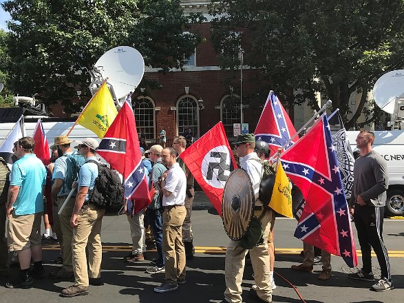 Alt-right members preparing to enter Emancipation Park holding Nazi, Confederate, and Gadsden