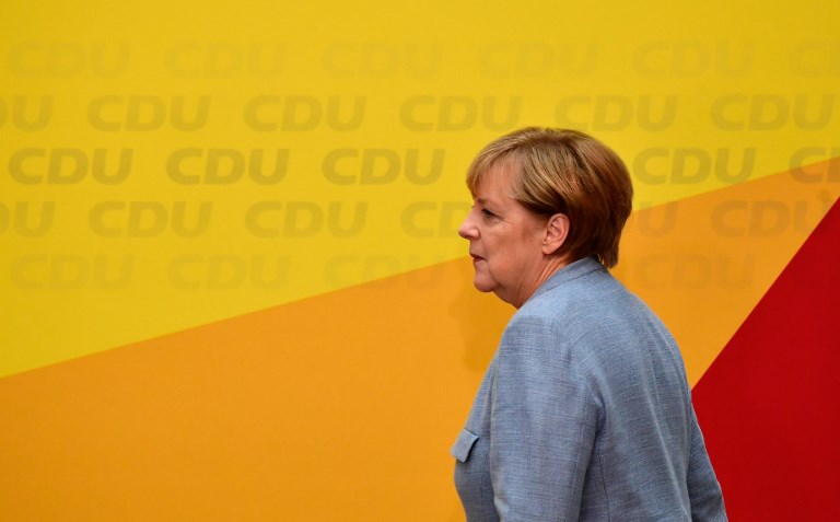German Chancellor Angela Merkel arrives to give a press conference at the headquarters of the Christian Democratic Union (CDU) party in Berlin on September 25, 2017, one day after general elections.