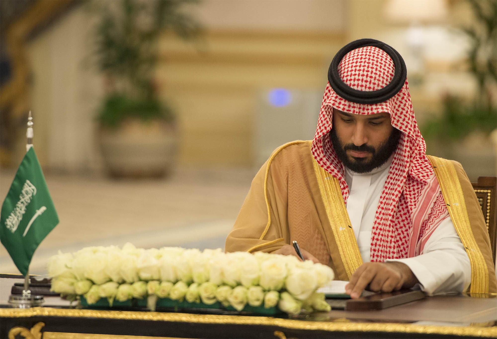 Saudi Crown Prince Mohammad bin Salman al-Saud and Vice Premier of China Zhang Gaoli (not seen) sign cooperation agreement during an inter-delegation meeting in Jeddah, Saudi Arabia on August 24, 2017.