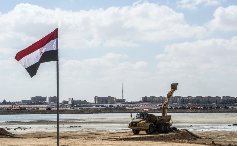 An Egyptian flag flying near a construction digger at the site of the New Alamein City, October 21, 2017.