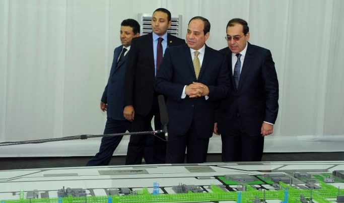 Egyptian President Abdel Fattah al-Sisi and Petroleum Minister Tarek al-Molla looking at mockups of natural gas extraction facilities during the inauguruation of the offshore Zohr gas field in the northern Suez canal city of Port Said. January 31, 2018.