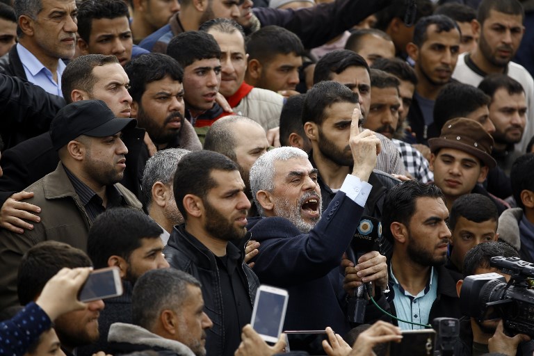 Hamas leader Yahya Sinwar shouts slogans as he takes part in a tent city protest near the border with Israel east of Jabalia in the northern Gaza strip to commemorate Land Day. March 30, 2018
