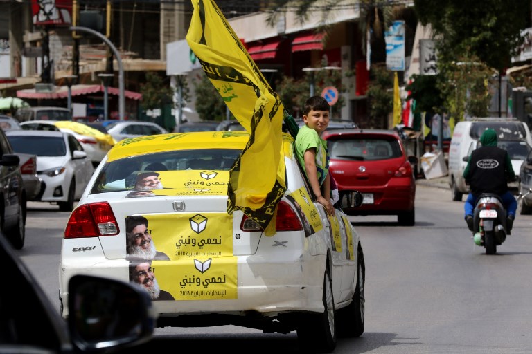 Supporters of Hezbollah tour the city of Nabatieh in southern Lebanon on May 6, 2018, as the country votes in its first parliamentary elections in nine years.