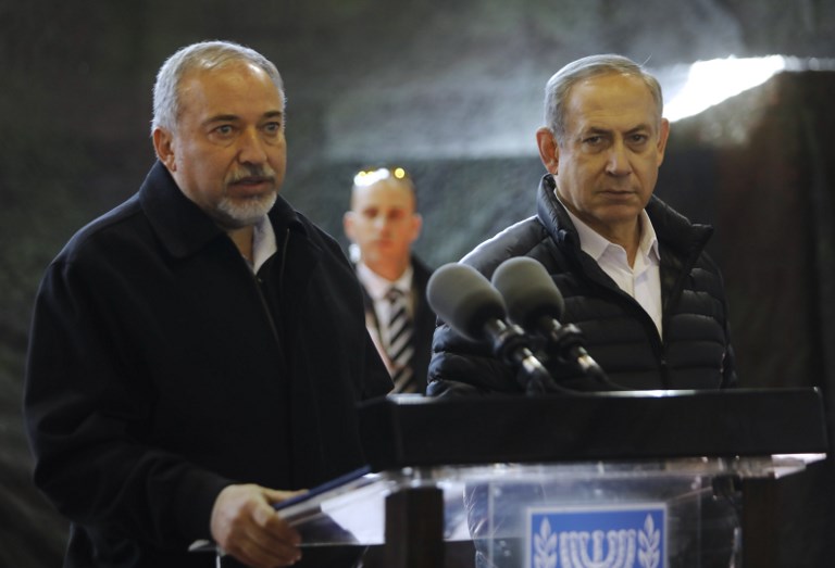 Israeli Prime Minister Benjamin Netanyahu and Defence Minister Avigdor Lieberman speak during a press conference at the army division headquarters in the settlement of Bet El, north of Ramallah in the West Bank, on January 10, 2017.