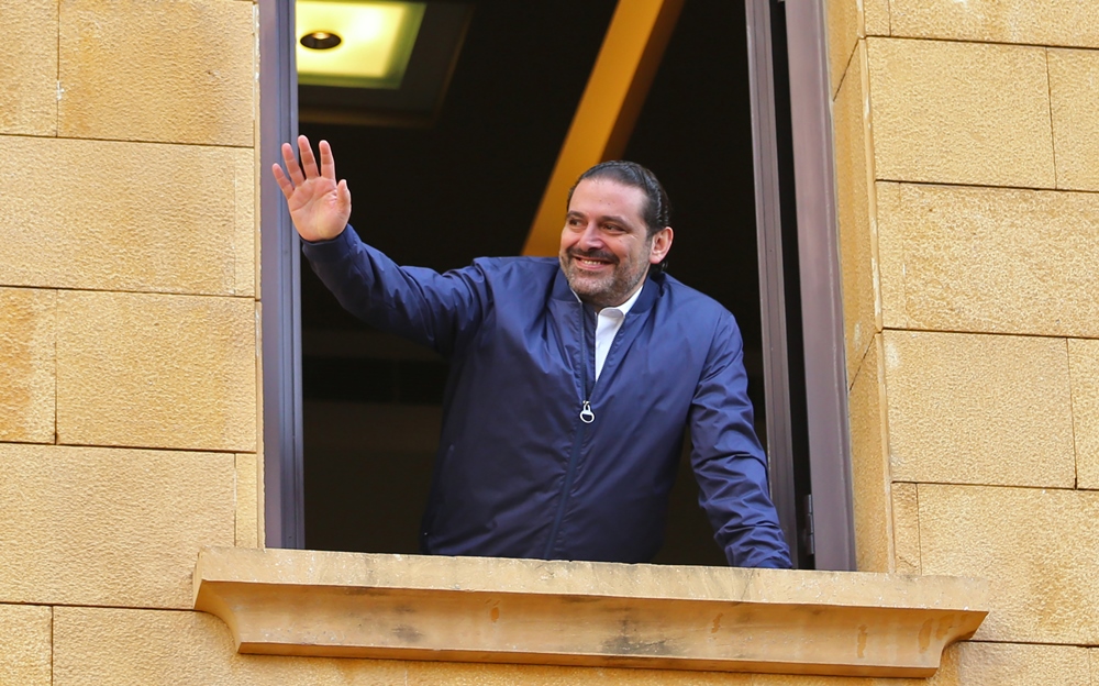 Lebanese prime minister Saad Hariri greets his supporters upon his arrival at his home in Beirut on November 22, 2017.