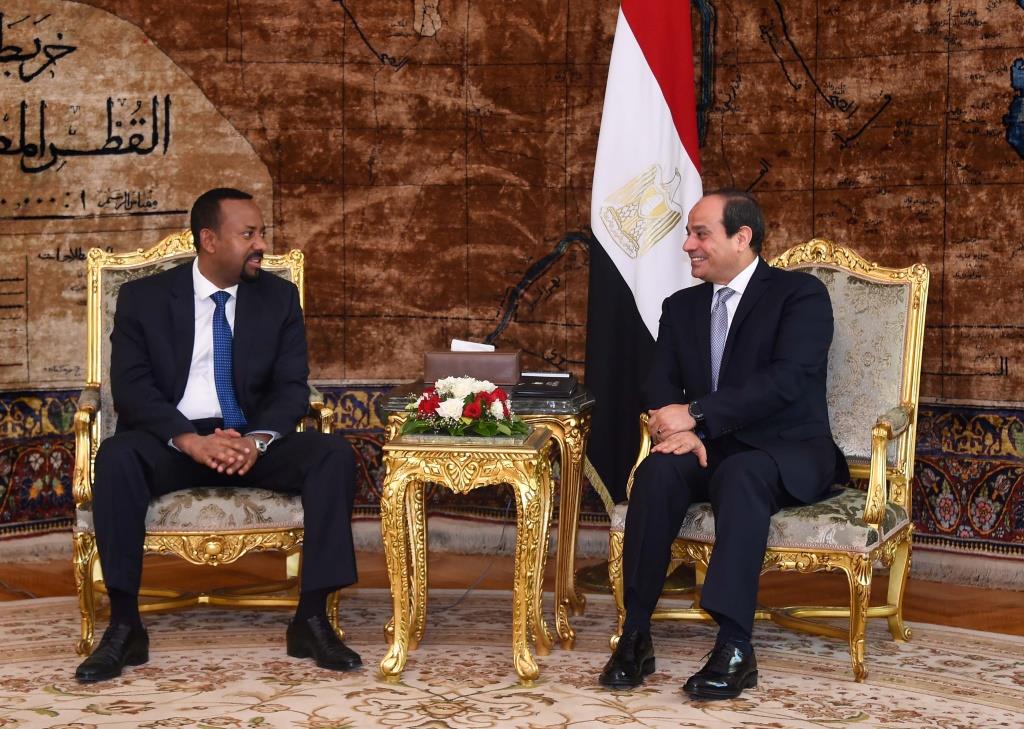 Egyptian President Abdel Fattah al-Sisi (R) meets with Ethiopian Prime Minister Abiy Ahmed at the Ittihadiya presidential palace in Cairo, Egypt, June 10, 2018. in this handout picture courtesy of the Egyptian Presidency.