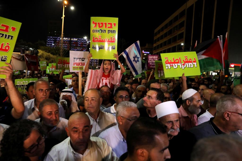 Israeli Arabs and their supporters take part in a rally to protest against Jewish nation-state law in Rabin square in Tel Aviv, Israel August 11, 2018.