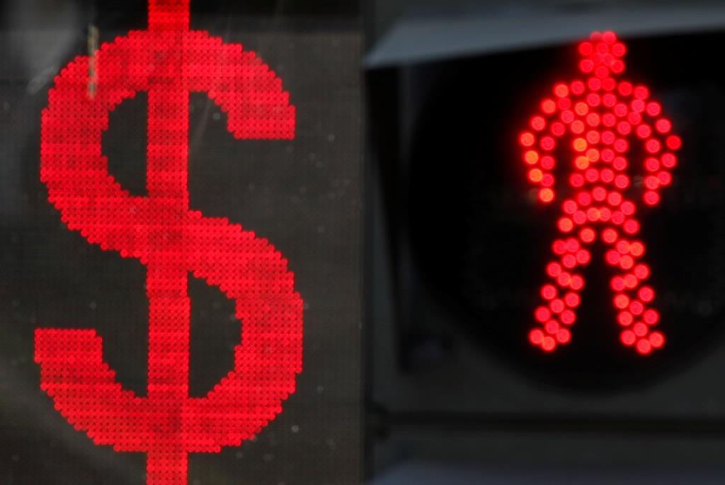 The U.S. dollar sign is seen on an electronic board next to a traffic light in Moscow, Russia August 10, 2018.