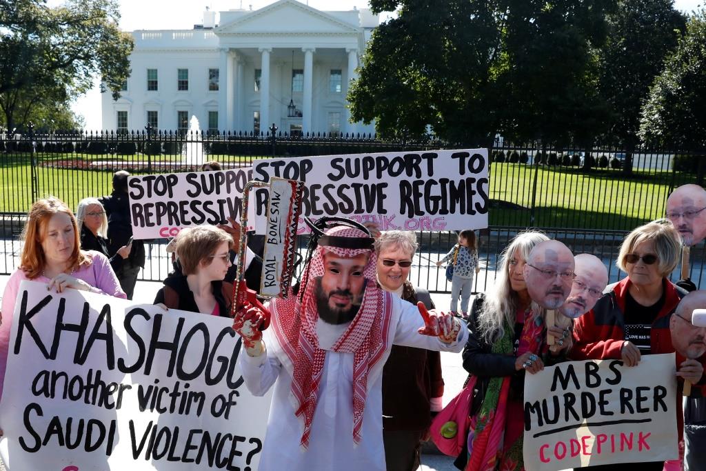An activist dressed as Saudi Crown Prince Mohammad bin Salman holds a prop bonesaw during a demonstration calling for sanctions against Saudi Arabia and to protest the disappearance of Saudi journalist Jamal Khashoggi, outside the White House in Washington, U.S., October 19, 2018.