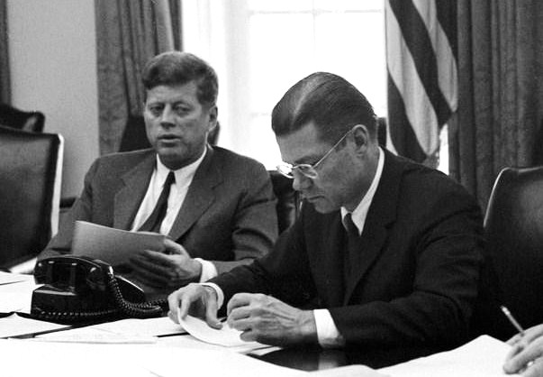 President John F. Kennedy meets with members of the Executive Committee of the National Security Council (EXCOMM) regarding the crisis in Cuba. (L-R) President Kennedy, Secretary of Defense Robert S. McNamara, and Deputy Secretary of Defense Roswell Gilpatric. Cabinet Room, White House, Washington, D.C. 29 October, 1962.