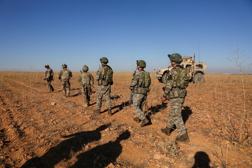 U.S. and Turkish soldiers conduct the first-ever combined joint patrol outside Manbij, Syria, November 1, 2018.