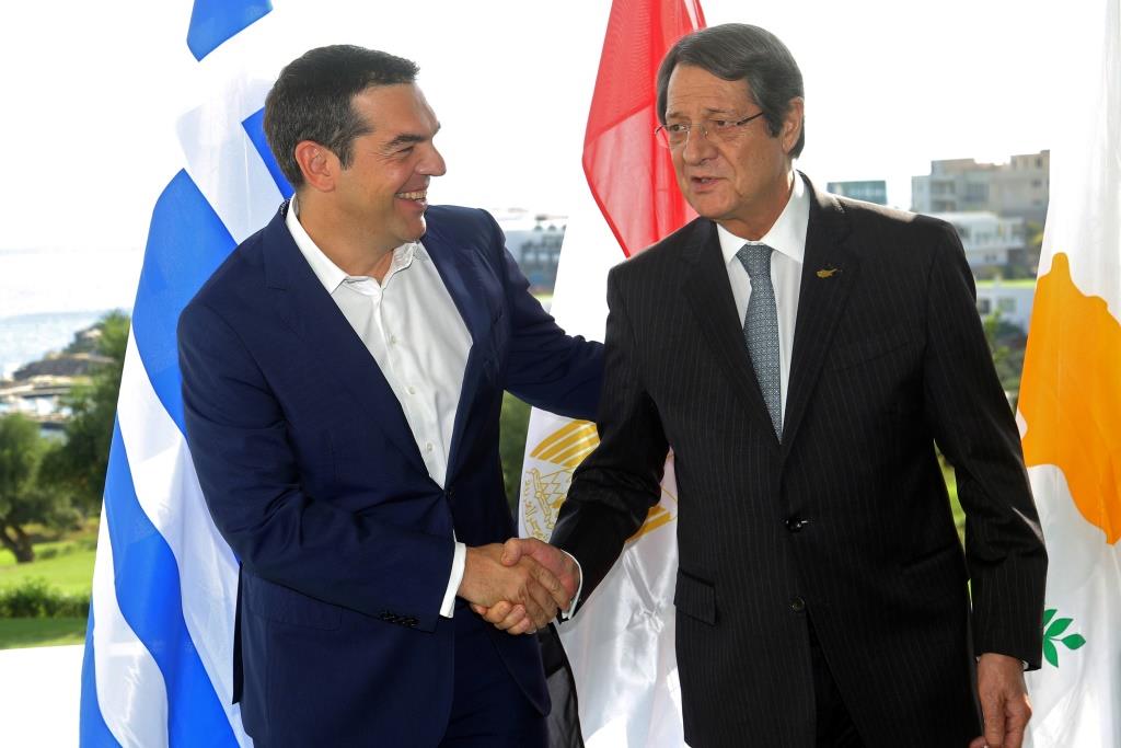 Greek Prime Minister Alexis Tsipras shakes hands with Cypriot President Nicos Anastasiades during a trilateral summit between Greece, Cyprus and Egypt, on the island of Crete, Greece October 10 2018.