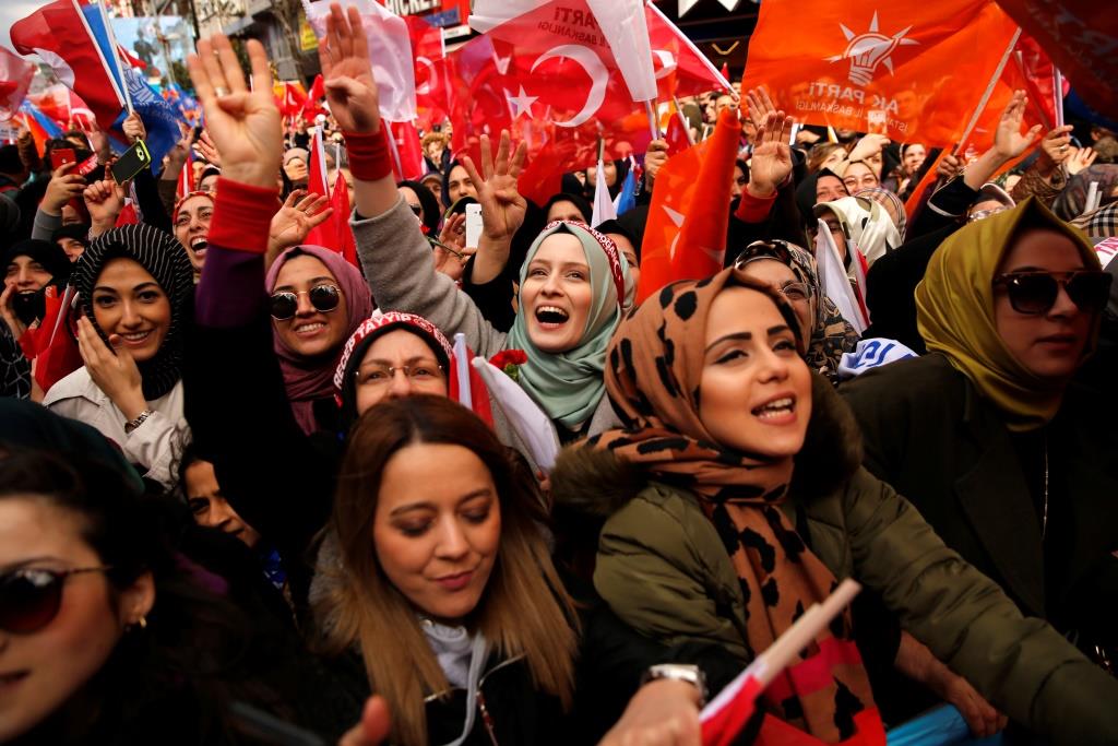 Supporters of Turkish President Tayyip Erdogan cheer during a rally for the upcoming local elections in Istanbul, Turkey, March 30, 2019.