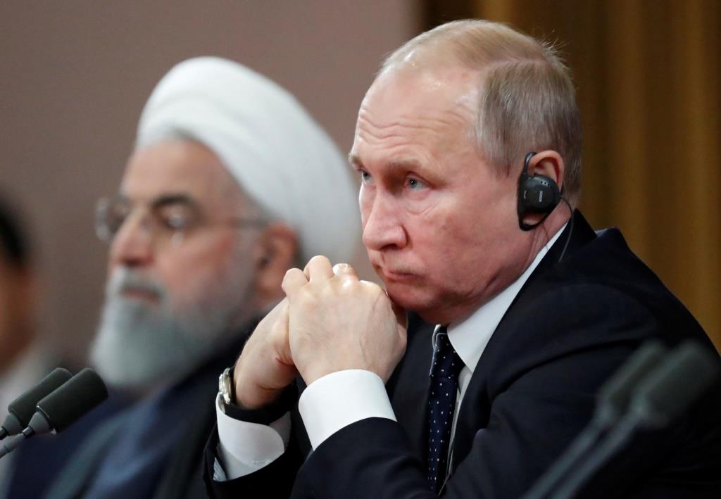 Russian President Vladimir Putin and Iranian President Hassan Rouhani attend a news conference, after a meeting in the Black sea resort of Sochi, Russia, 14 February 2019.