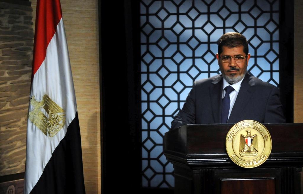 Muslim Brotherhood's president-elect Mohamed Mursi speaks during his first televised address to the nation at the Egyptian Television headquarters in Cairo June 24, 2012.