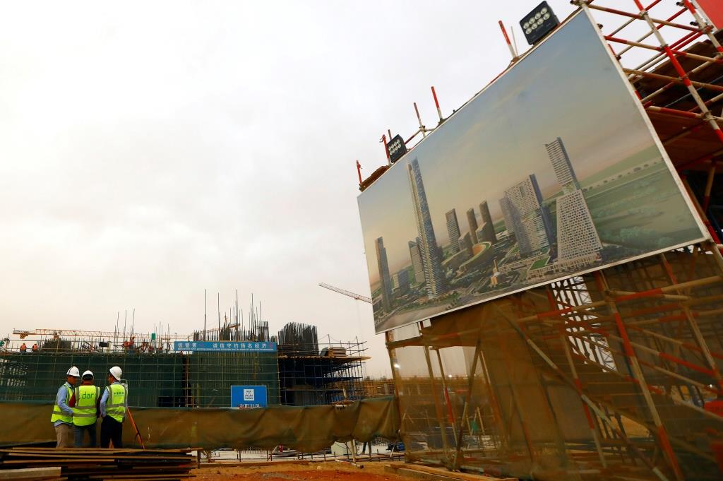 Chinese construction labourers work at the site of the future Iconic Tower skyscraper, at its foundations in the business district, being built by China State Construction Engineering Corp (CSCEC) in the New Administrative Capital (NAC) east of Cairo, Egypt May 2, 2019.