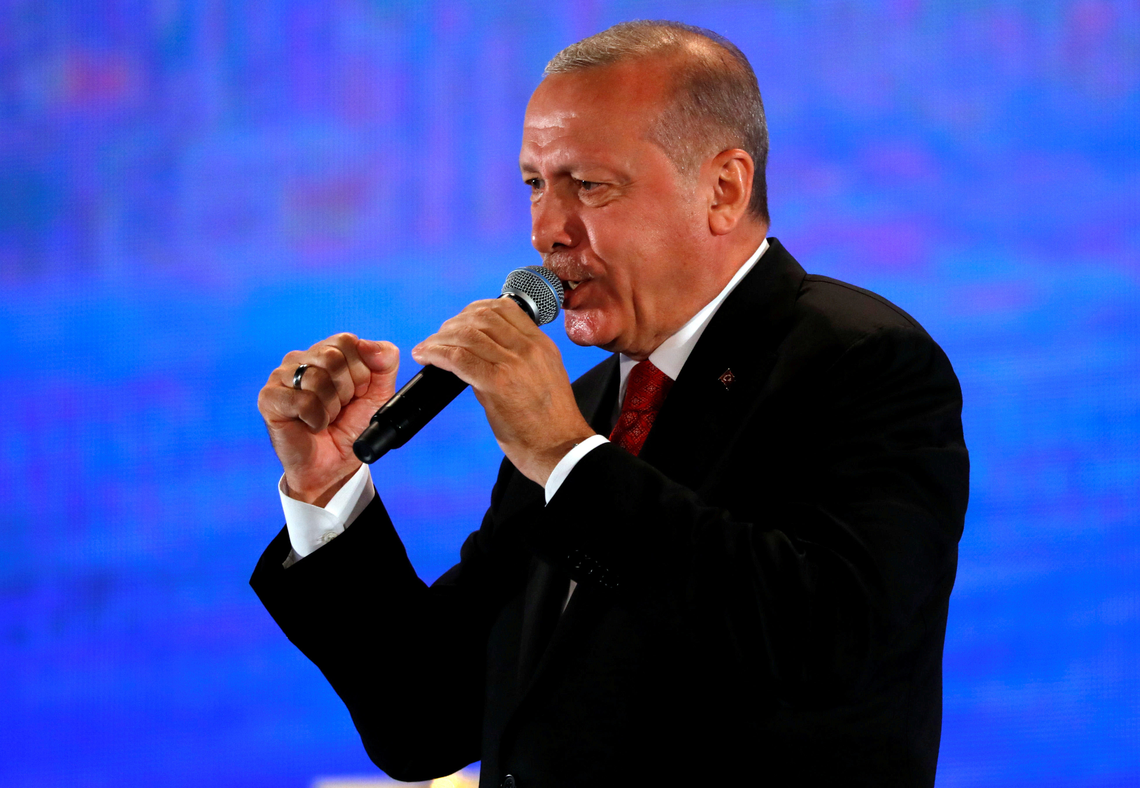 Turkish President Tayyip Erdogan addresses his supporters during a ceremony marking the third anniversary of the attempted coup at Ataturk Airport in Istanbul, Turkey, July 15, 2019.