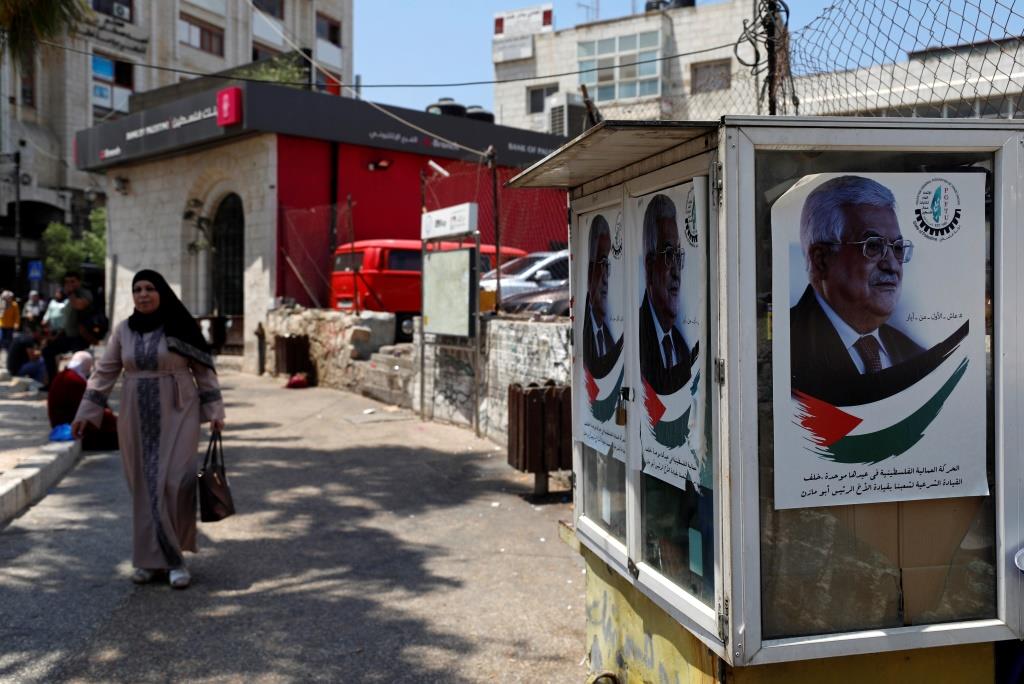 Pictures depicting Palestinian President Mahmoud Abbas are seen in Ramallah, the West Bank. June 12, 2019.