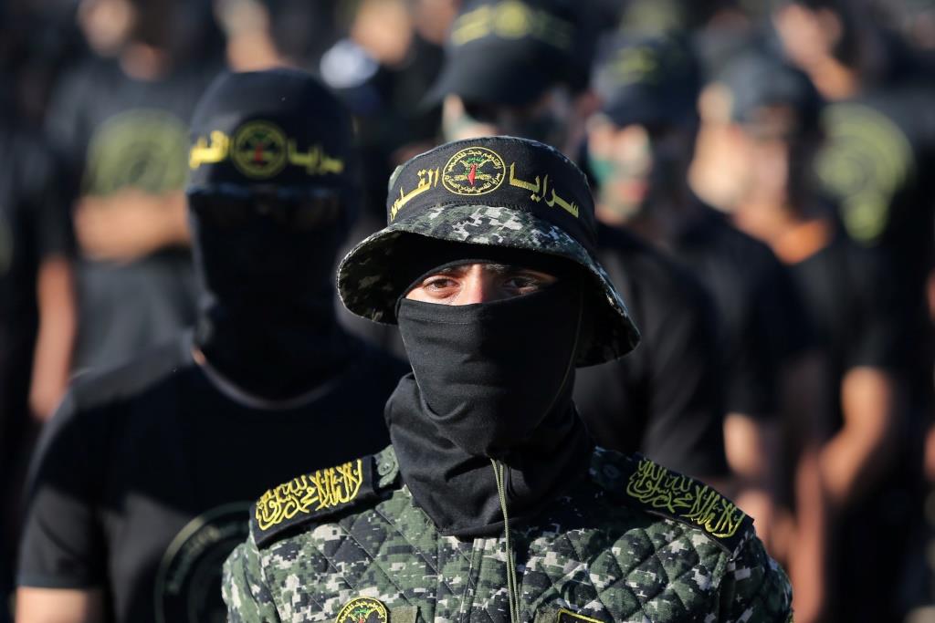 A masked young Palestinian takes part in a military-style graduation ceremony at a summer camp organised by Islamic Jihad, in Gaza City July 4, 2019.
