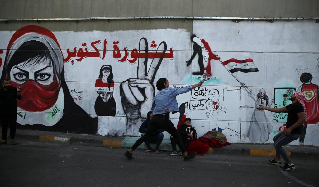 Iraqi demonstrators play badminton during ongoing anti-government protests, in Baghdad, Iraq November 19, 2019.