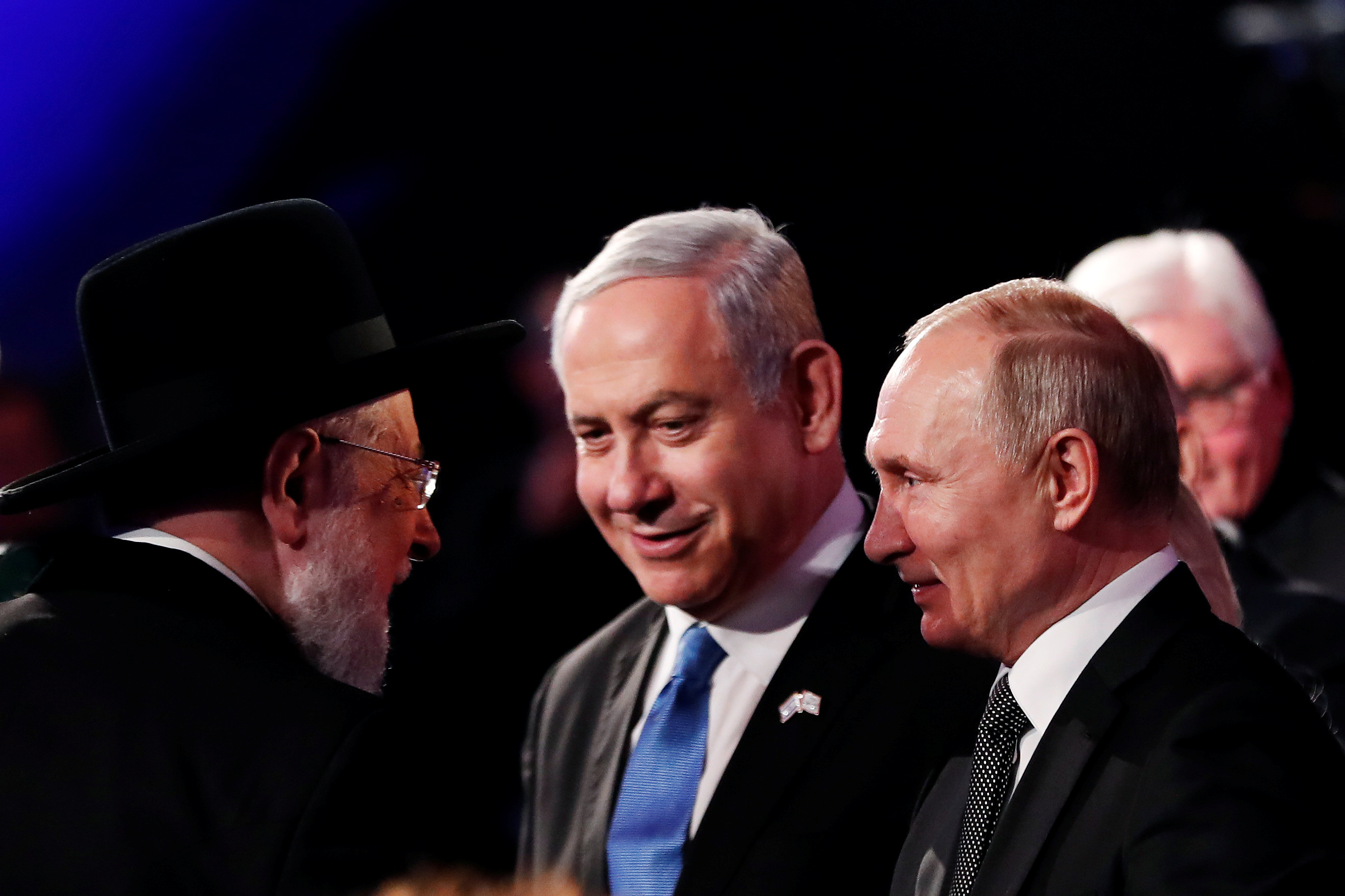 Rabbi Israel Meir Lau Chairman of the Yad Vashem Council speaks to Israeli Prime Minister Benjamin Netanyahu and Russian President Vladimir Putin at the World Holocaust Forum marking 75 years since the liberation of the Nazi extermination camp Auschwitz, at Yad Vashem Holocaust memorial centre in Jerusalem January 23, 2020