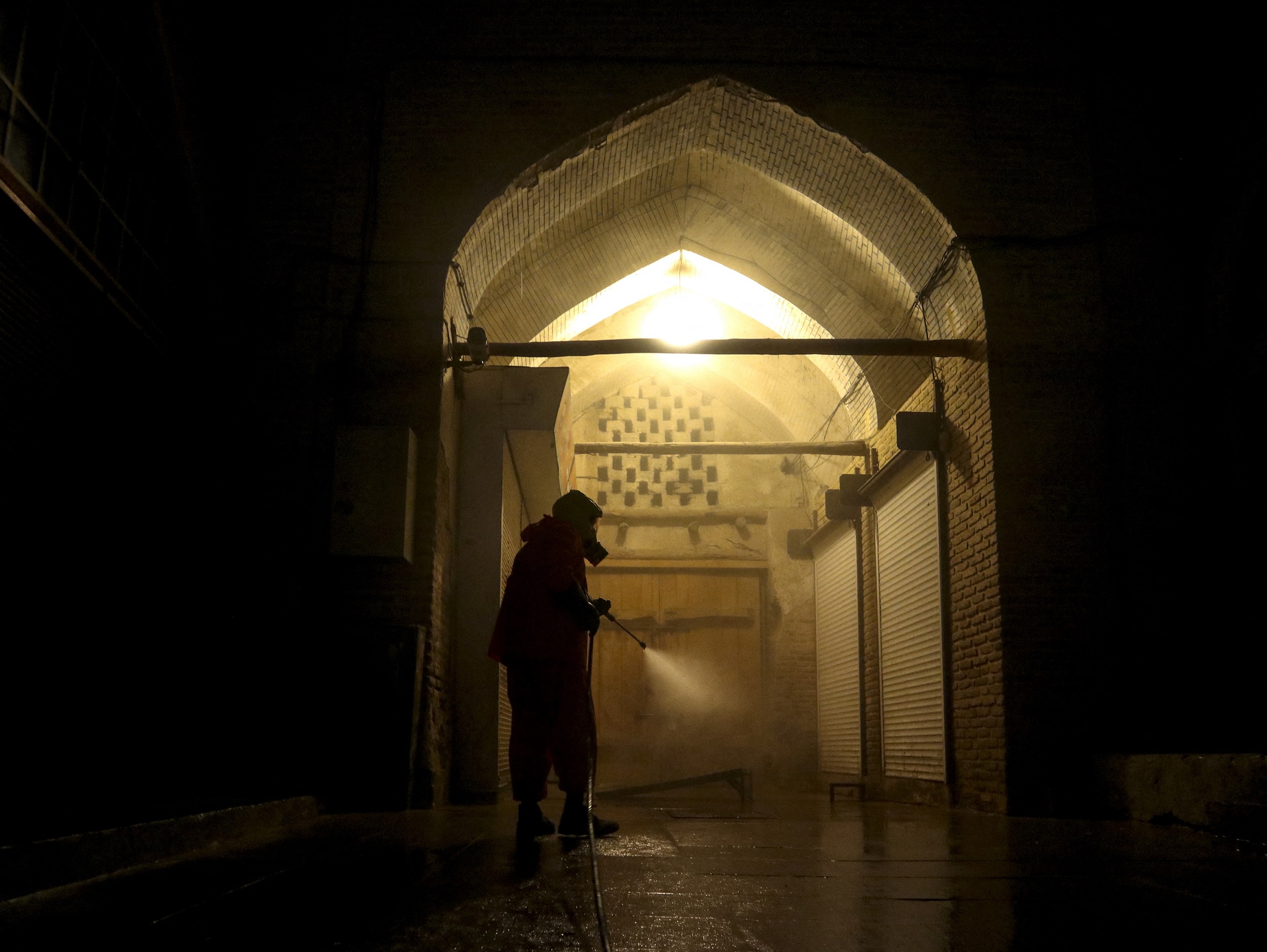 Municipality works and security forces spray during the disinfection process as a precaution against coronavirus (COVID-19) in Shiraz, March 3, 2020.