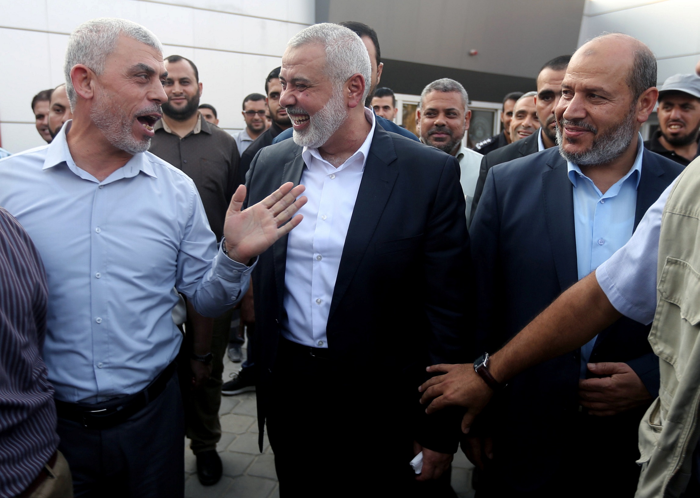 Hamas Gaza Chief Yehya Al-Sinwar (L) gestures as he speaks with Hamas chief Ismail Haniyeh at the Rafah border crossing in the southern Gaza Strip September 19, 2017.